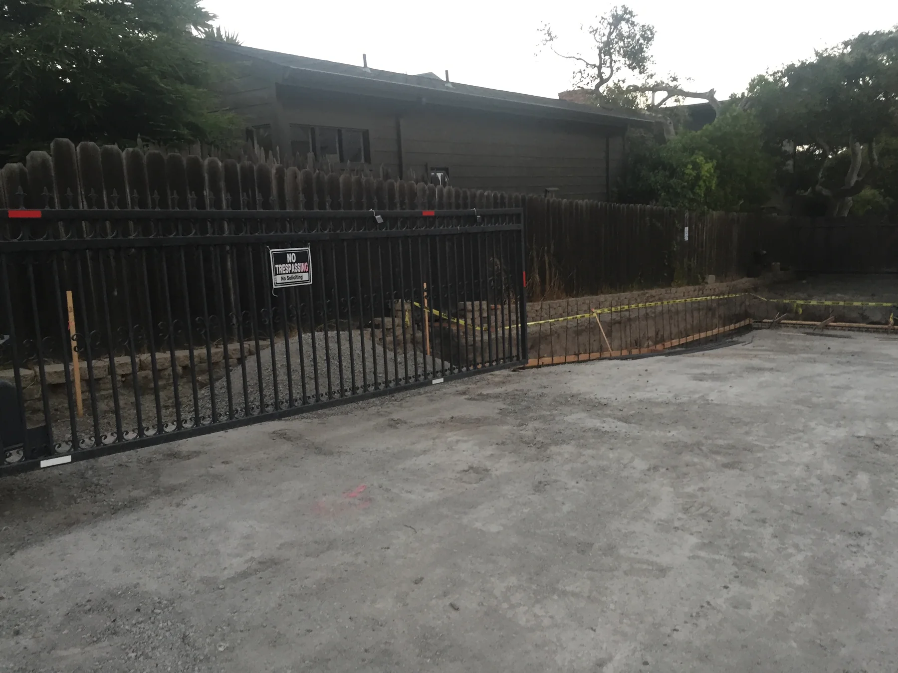 Custom iron gate and finished driveway entrance