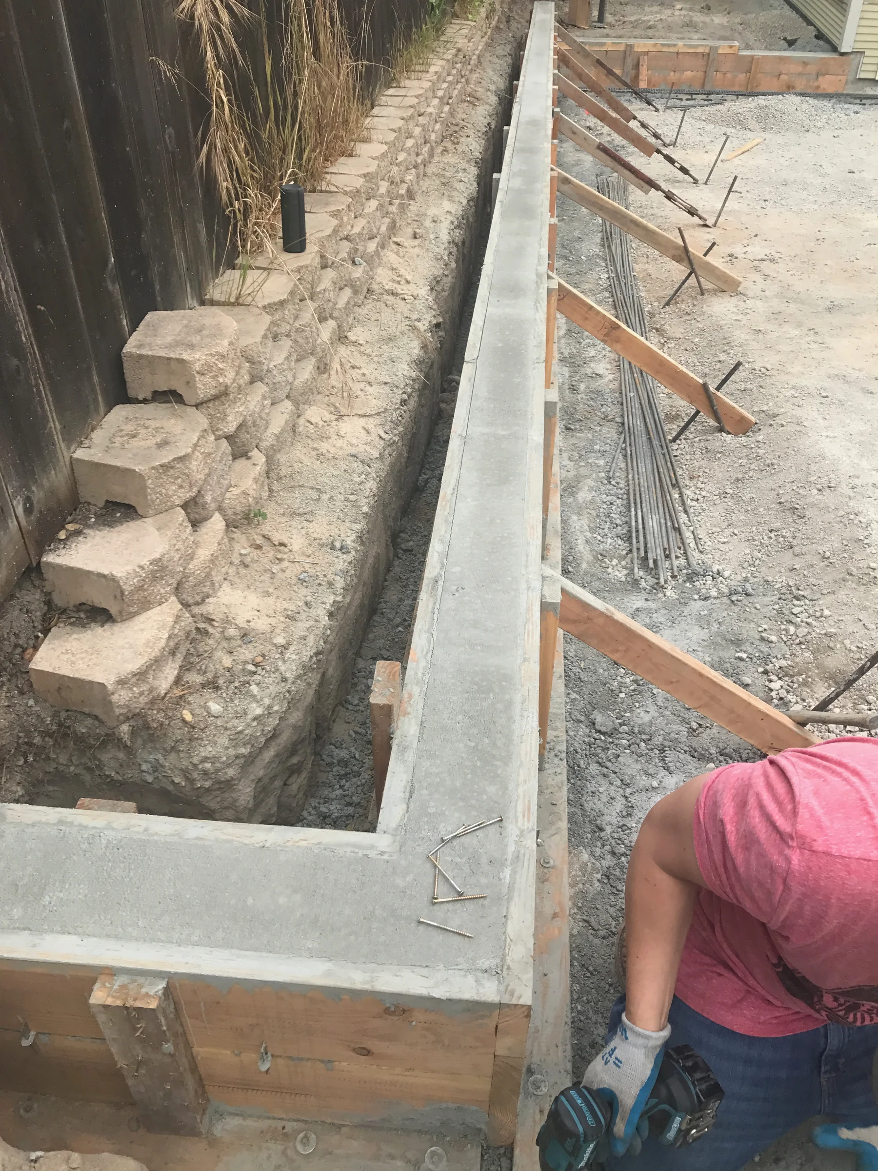 Concrete beam and masonry retaining-wall detail